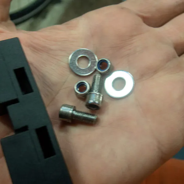 Some M5 hex bolts, wash­ers and nuts.